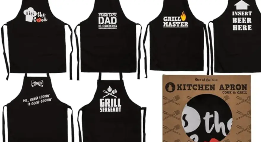 Varios delantales negros con frases divertidas para cocinar y asar: "Kiss the Cook", "Dad is Cooking", "Grill Master", "Insert Beer Here", "Mr. Good Lookin is Good Cookin" y "Grill Sergeant".