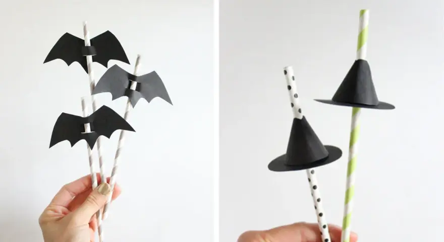 Decoración Halloween manualidades: pajitas con murciélagos de papel negro y sombreros de bruja.